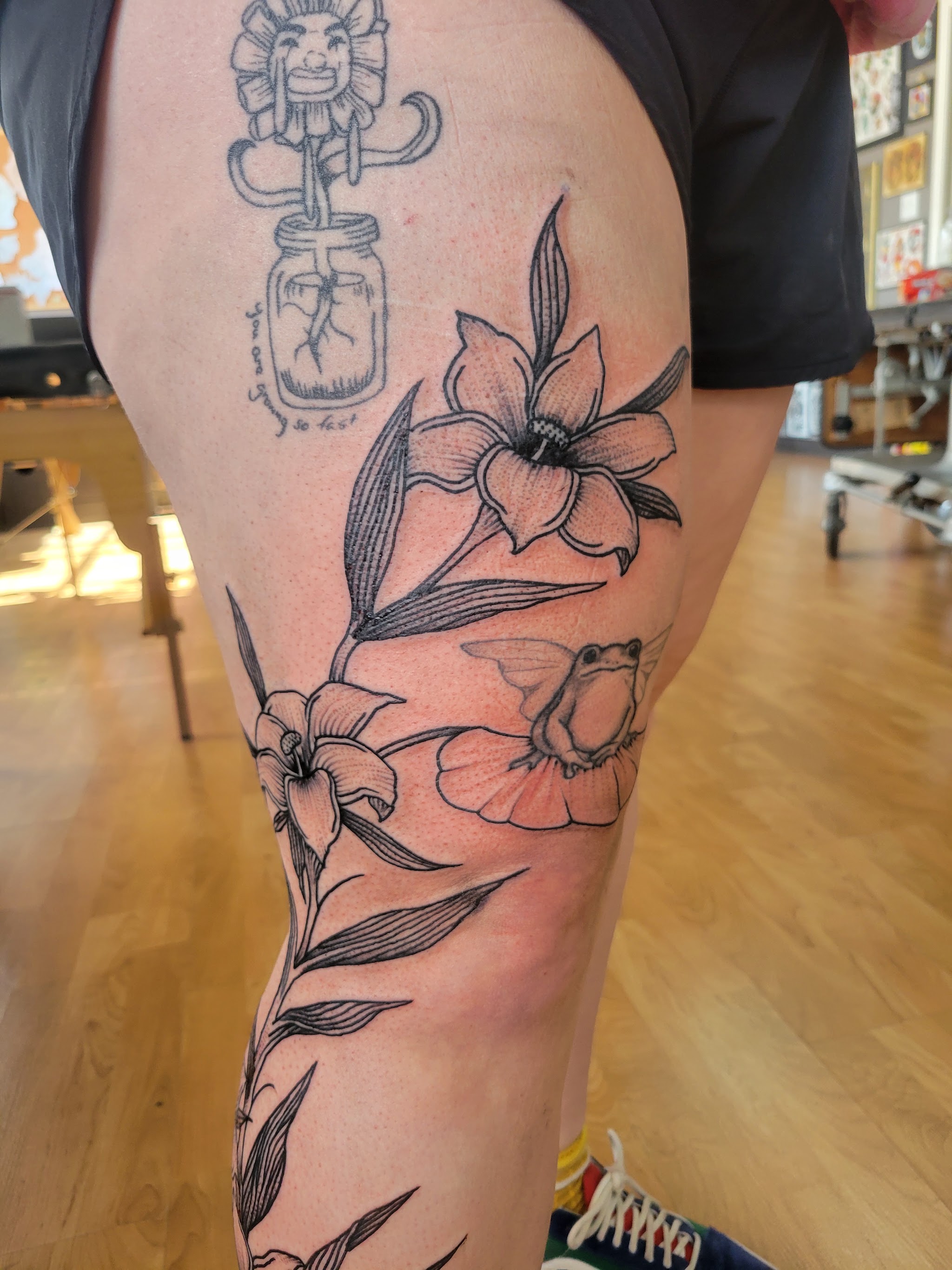 Fine line lilies and a small frog