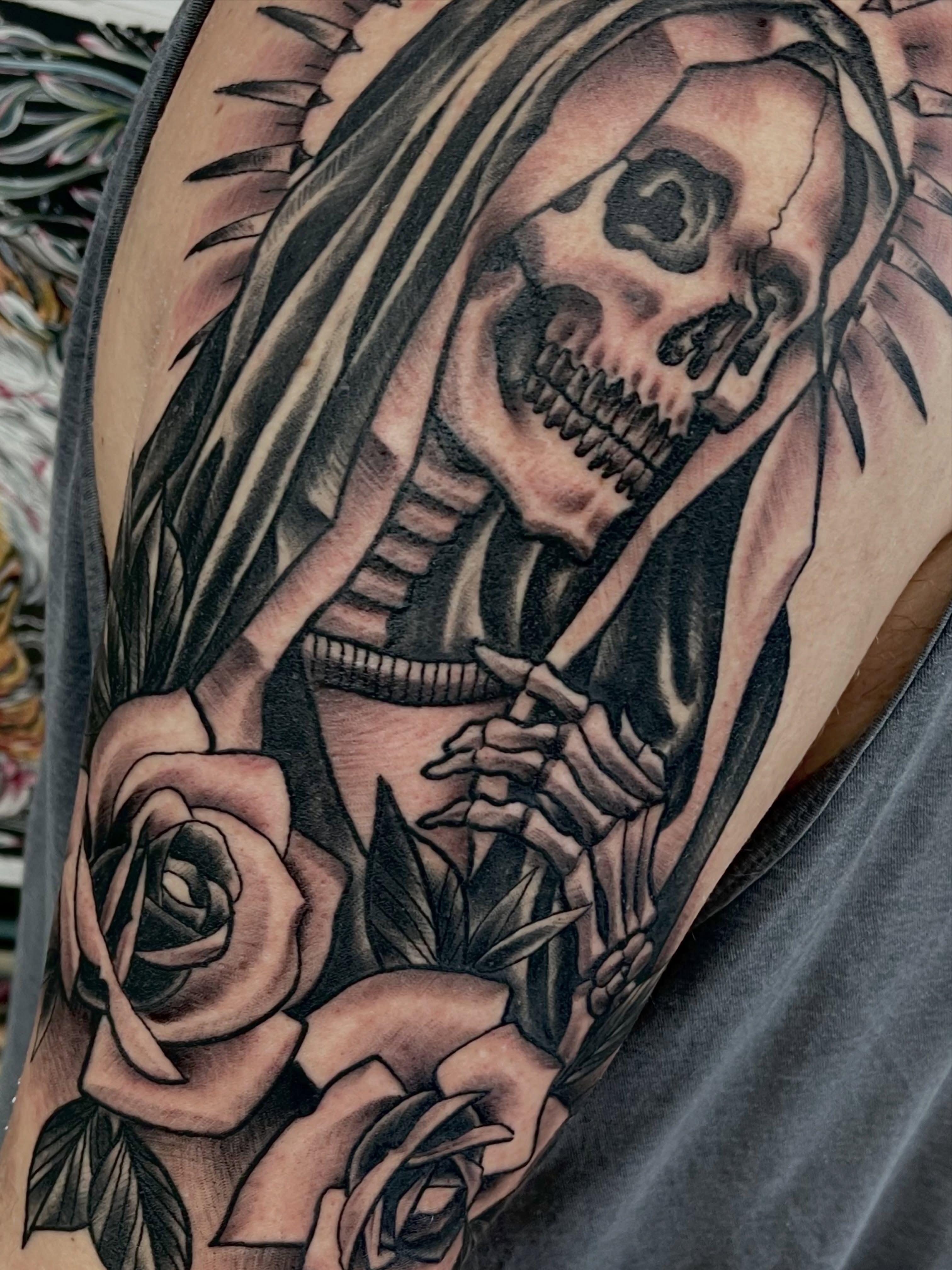 Hooded reaper and roses